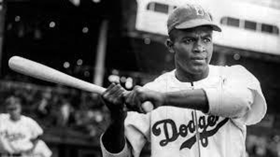 Jackie Robinson holding a bat