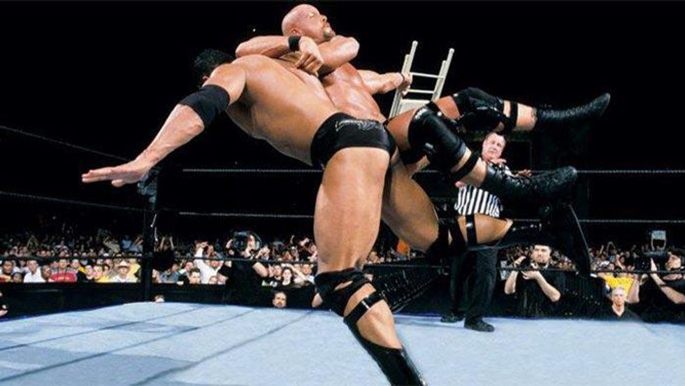 The Rock landing his Rock Bottom finisher on Stone Cold Steve Austin