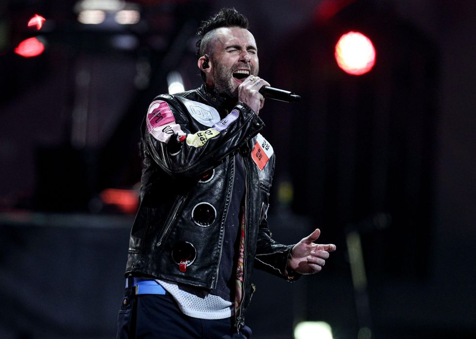 Adam Levine performing with Maroon 5